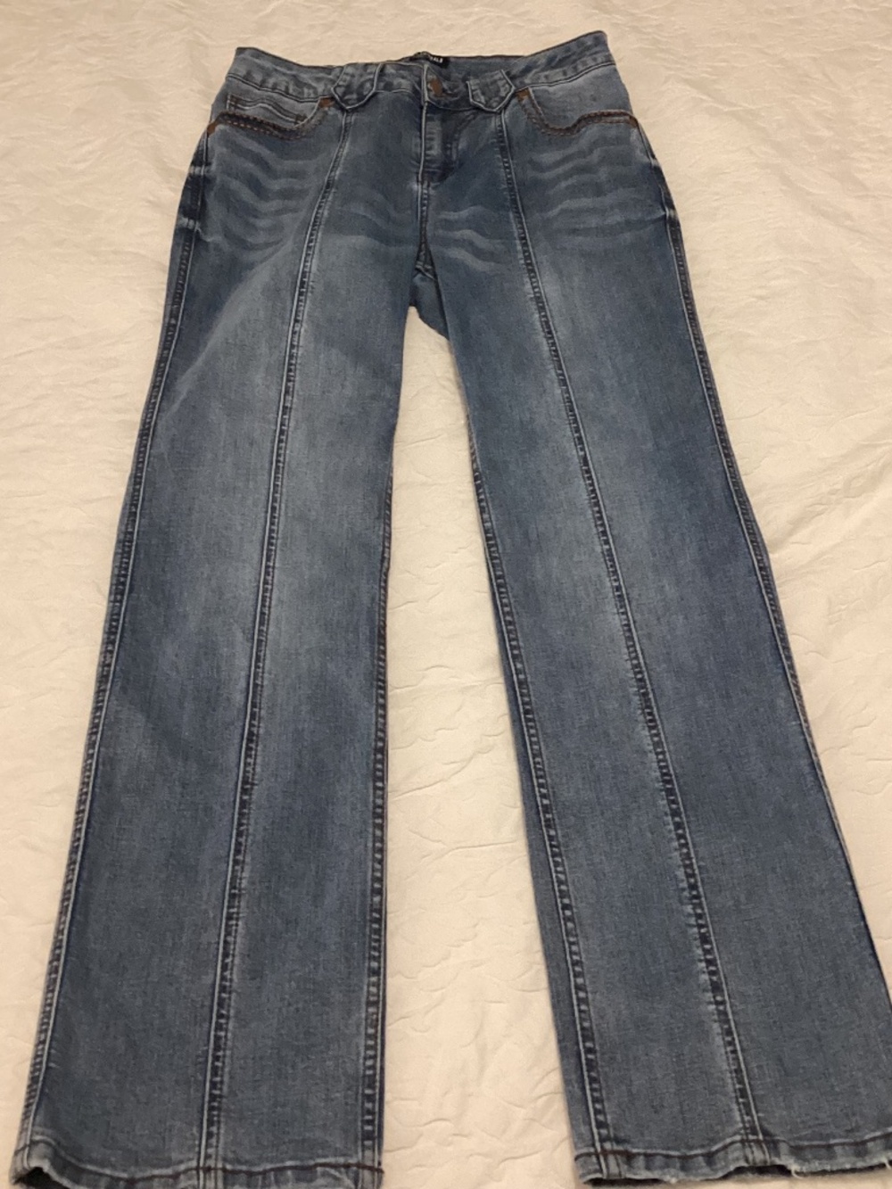 Flamingals 30” waist, size 10 with lighter colored blue denim jeans